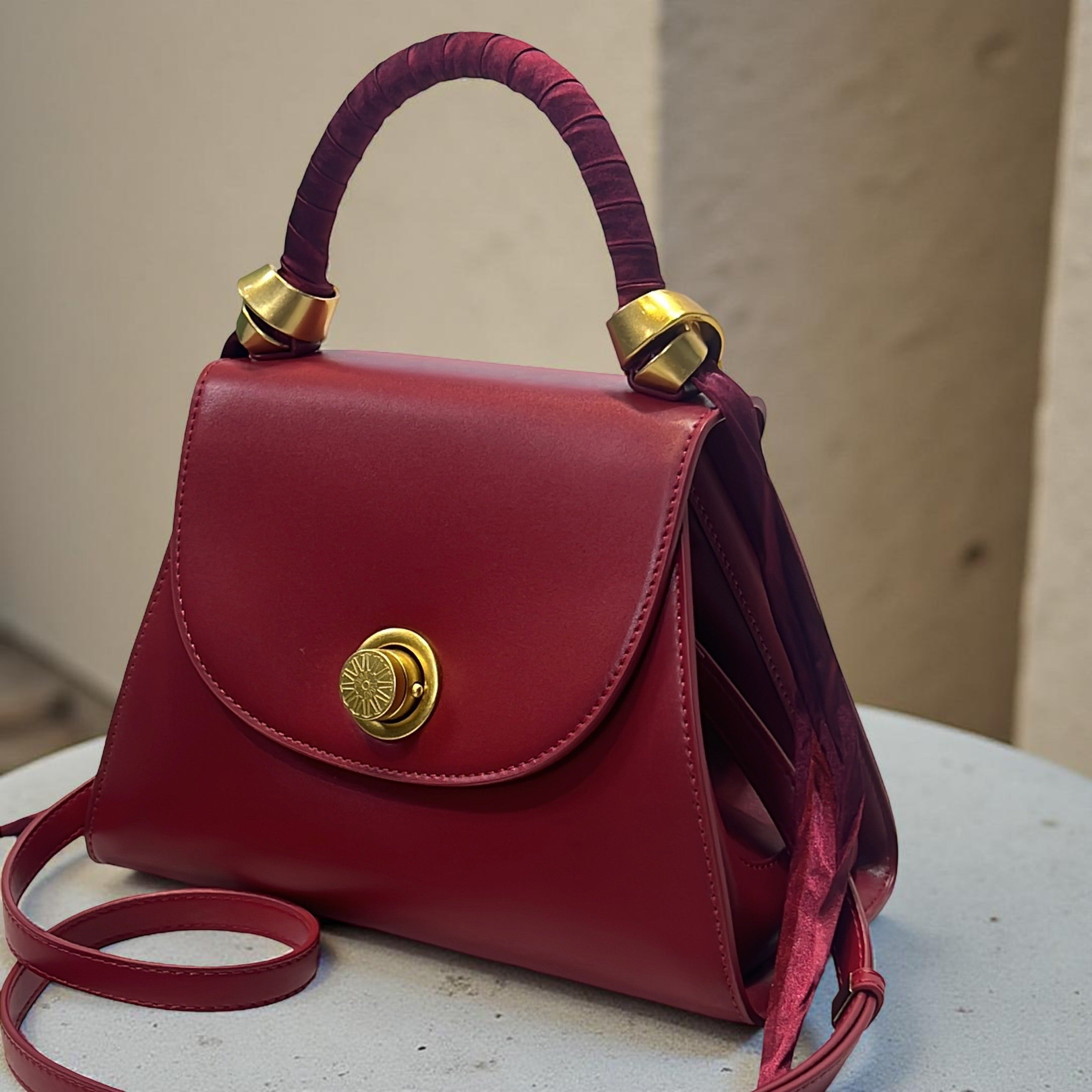 Versse Top Handle Winged Bag in Wine