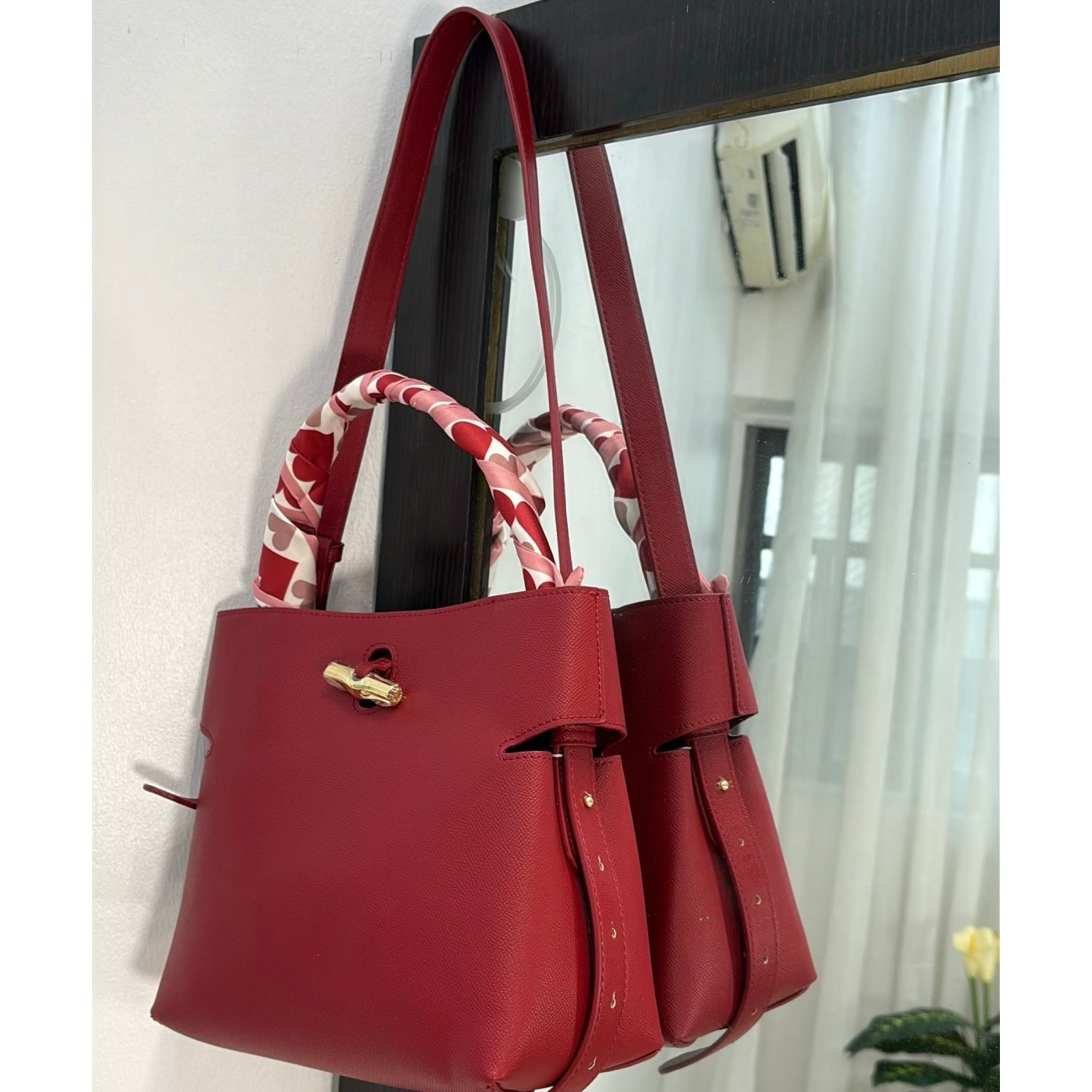 Versse Leather Bucket Bag in Bordo