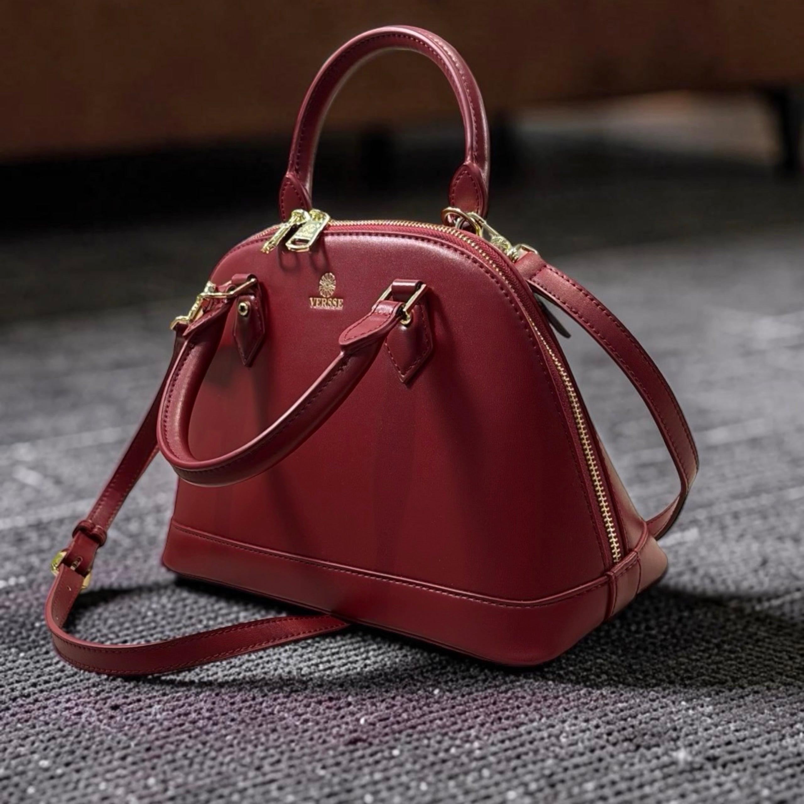 Versse Oval Top Handbag in Maroon