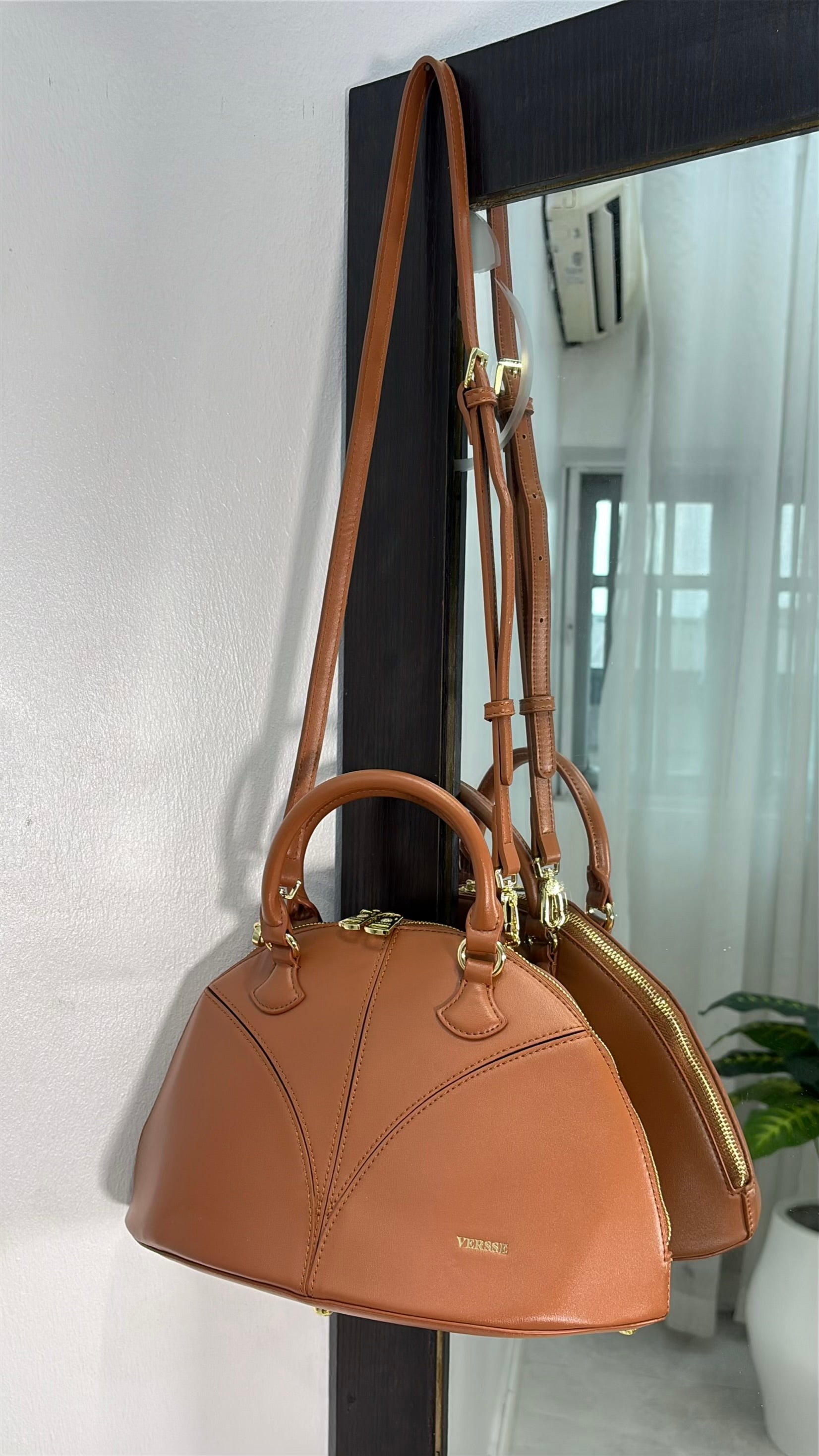 Versse Half-Moon handbag in Brown