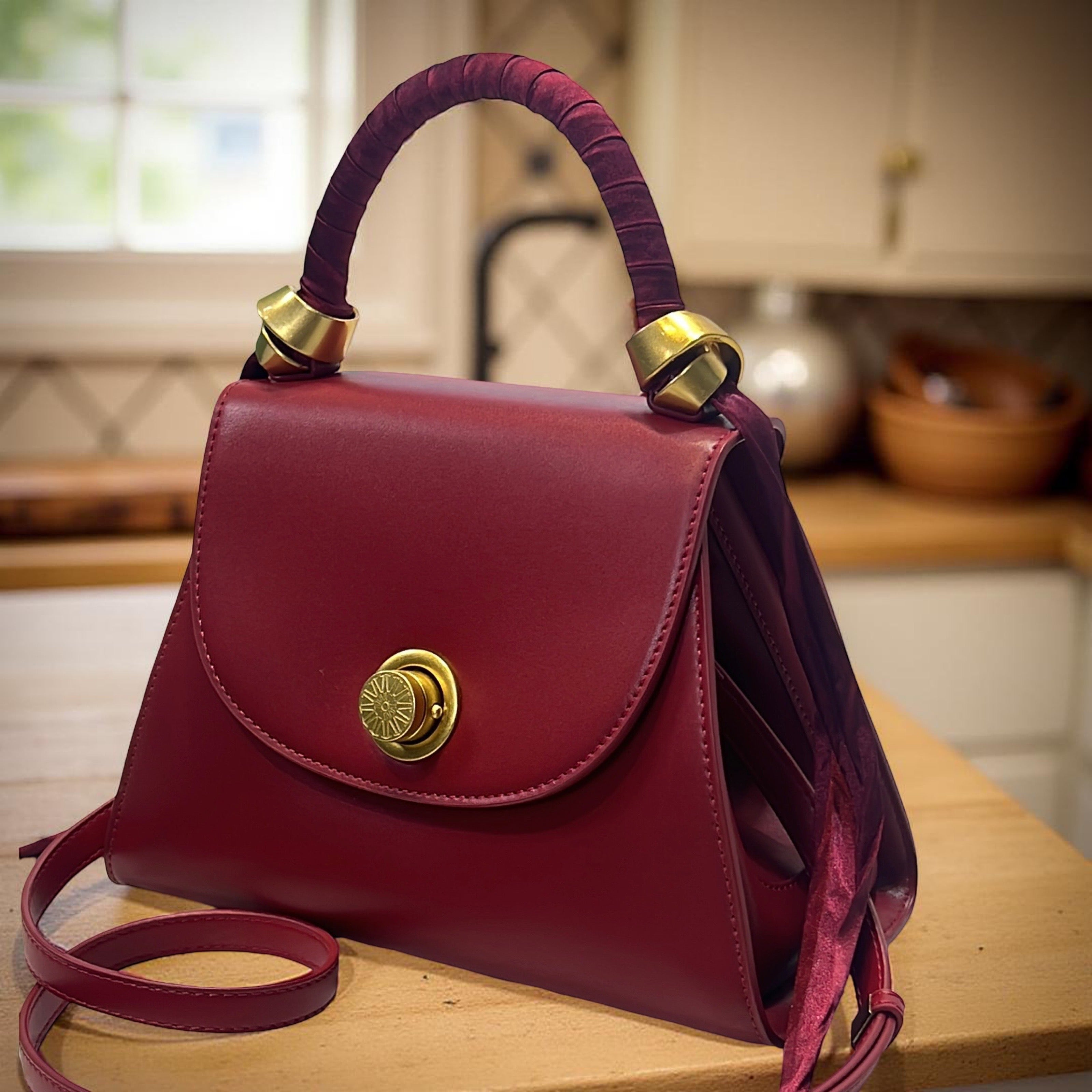 Versse Top Handle Winged Bag in Wine