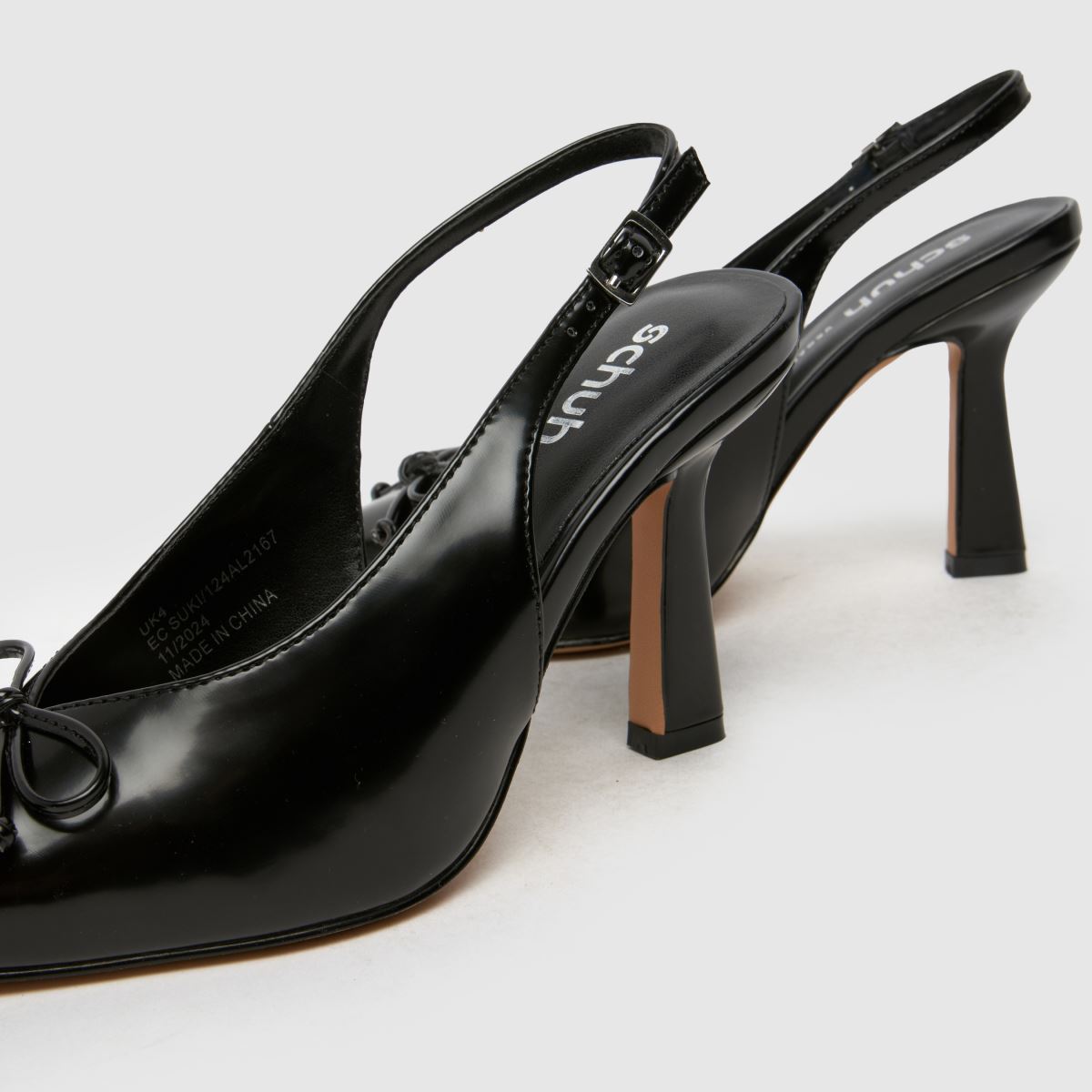 Schuh Bow Detail Patent Leather Pointed Toe Pump in Black