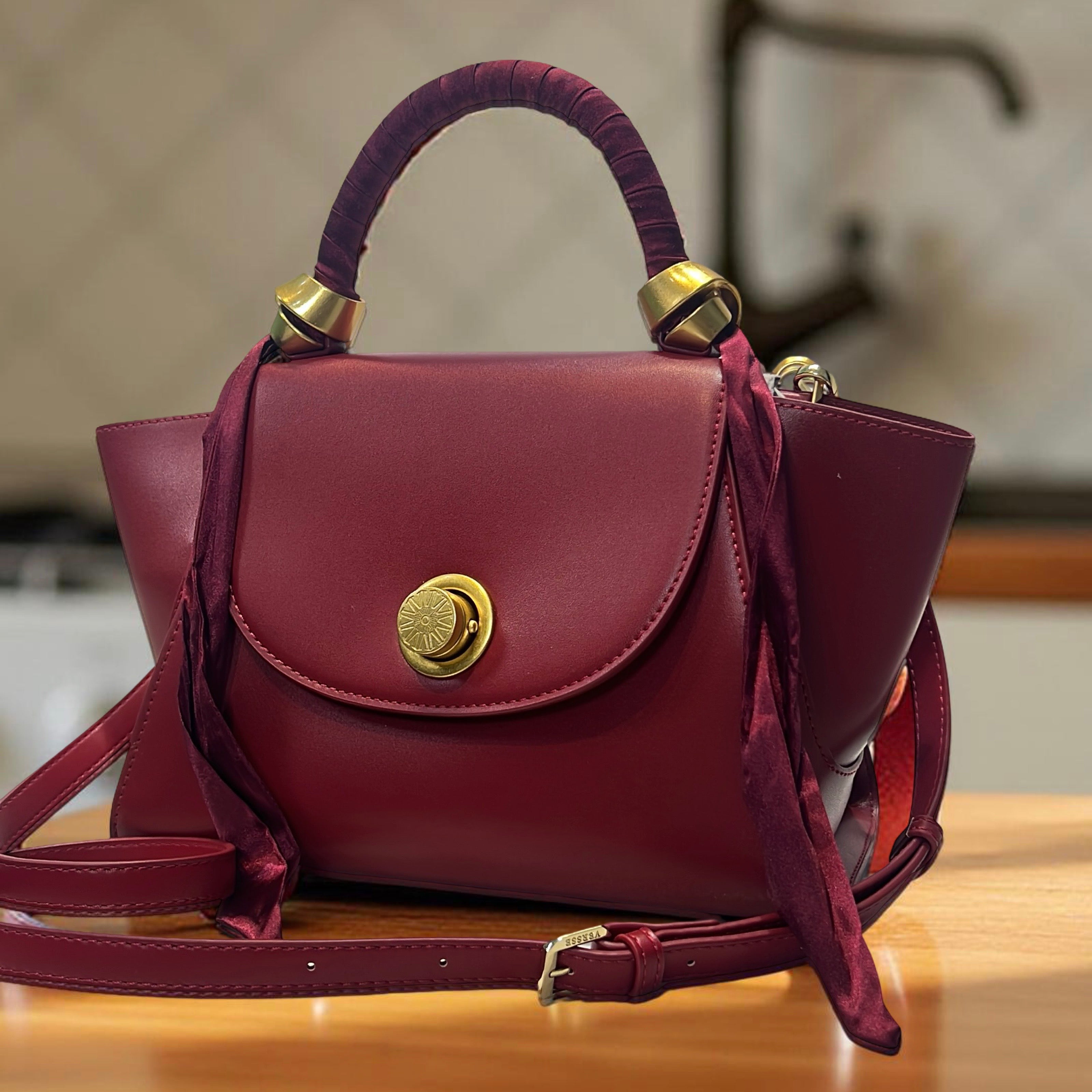 Versse Top Handle Winged Bag in Wine