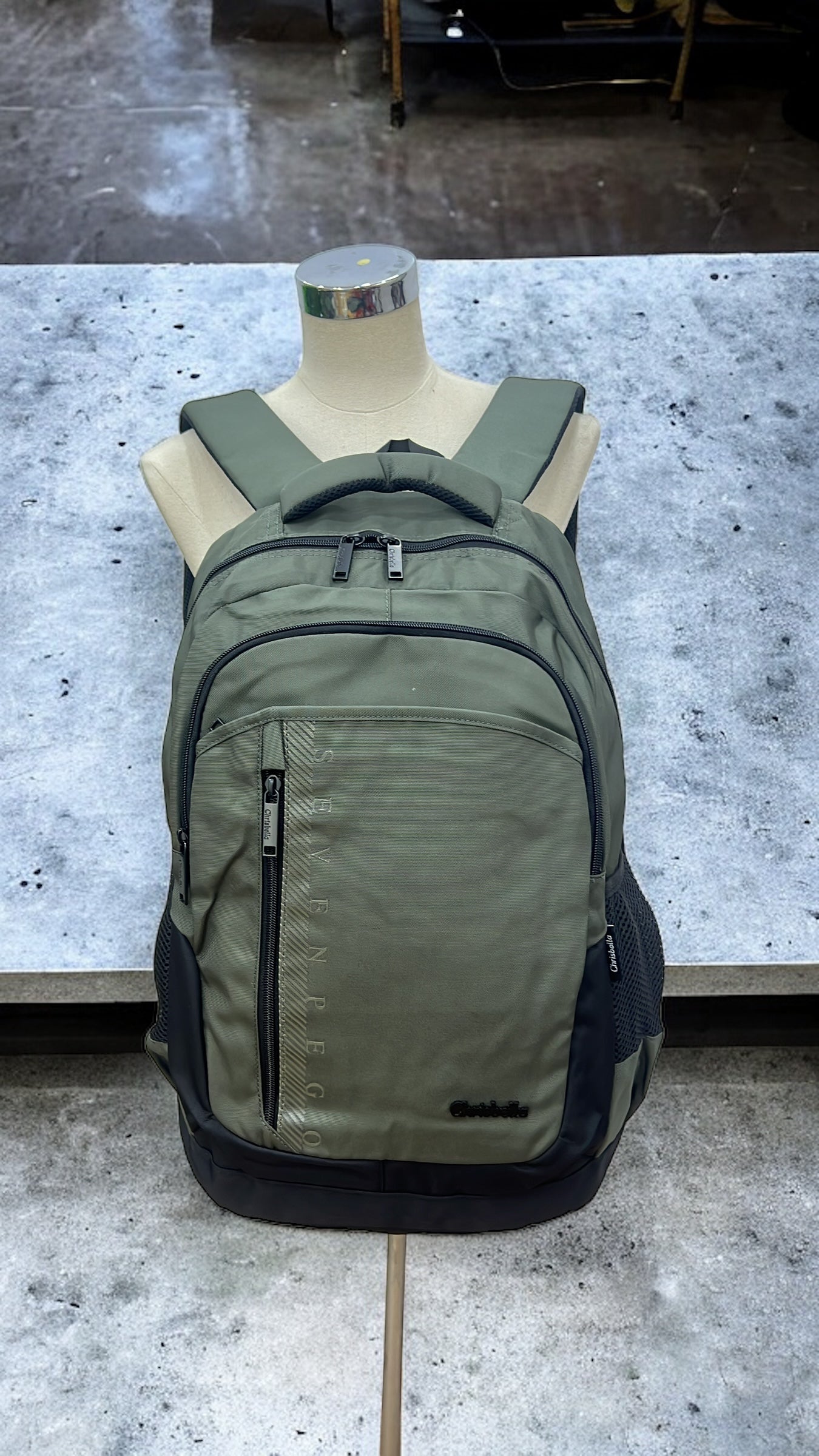 CHRISBELLA SEVEN PEGO BACKPACK IN ARMY GREEN