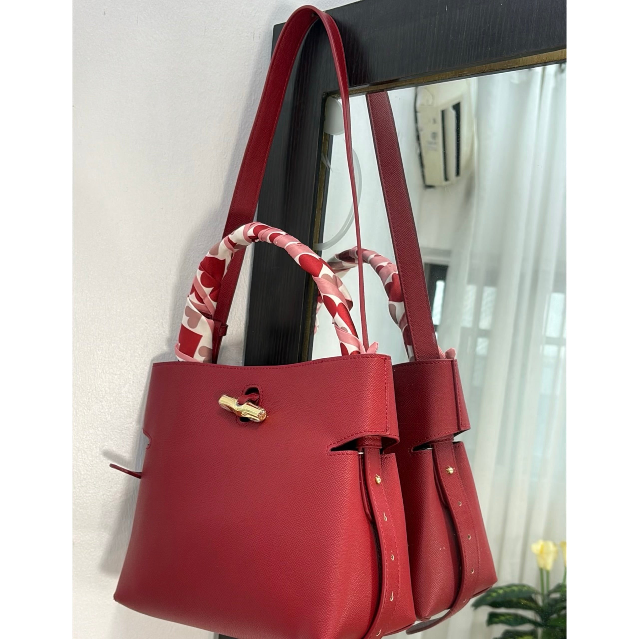 Versse Leather Bucket Bag in Bordo