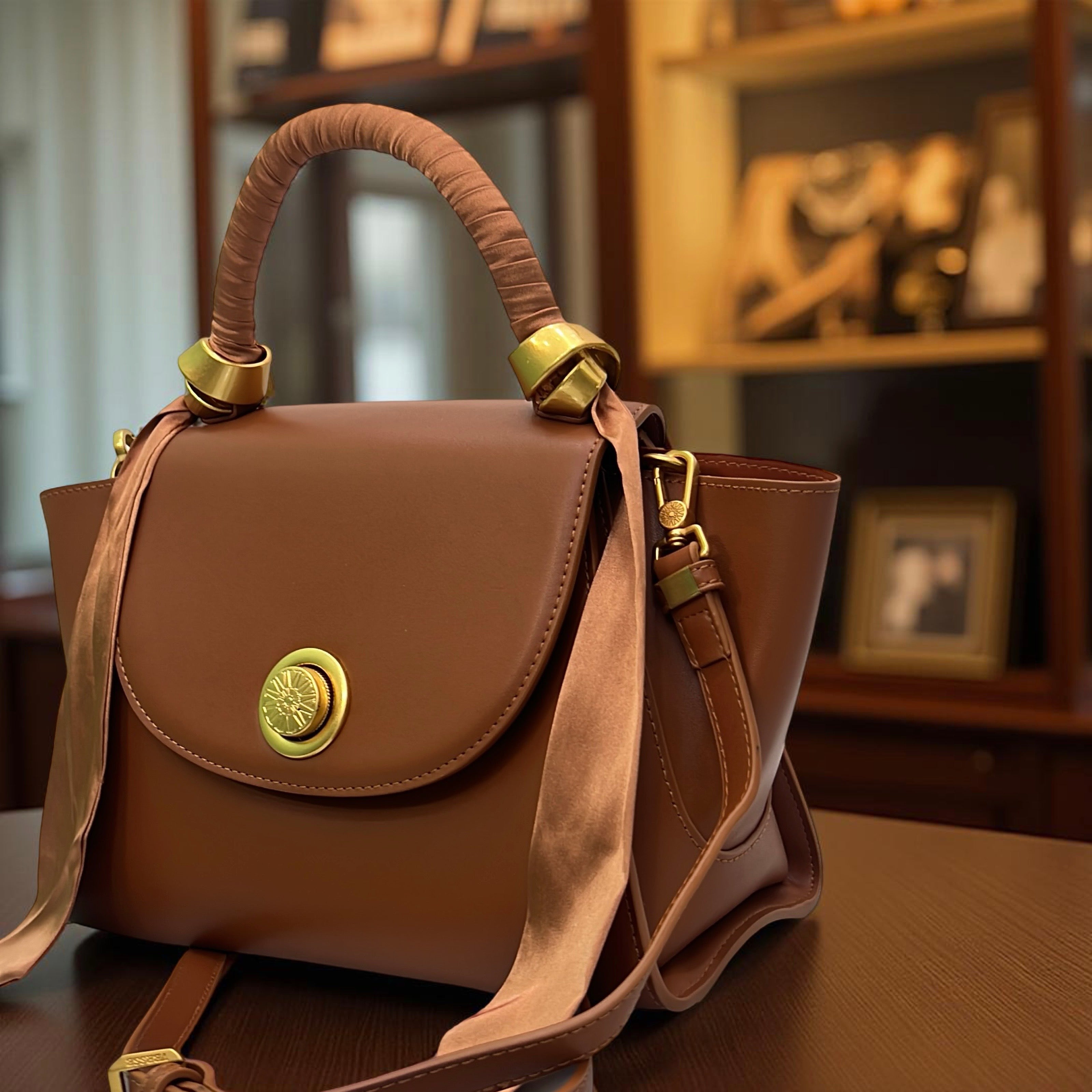 Versse Top Handle Winged Bag in Brown
