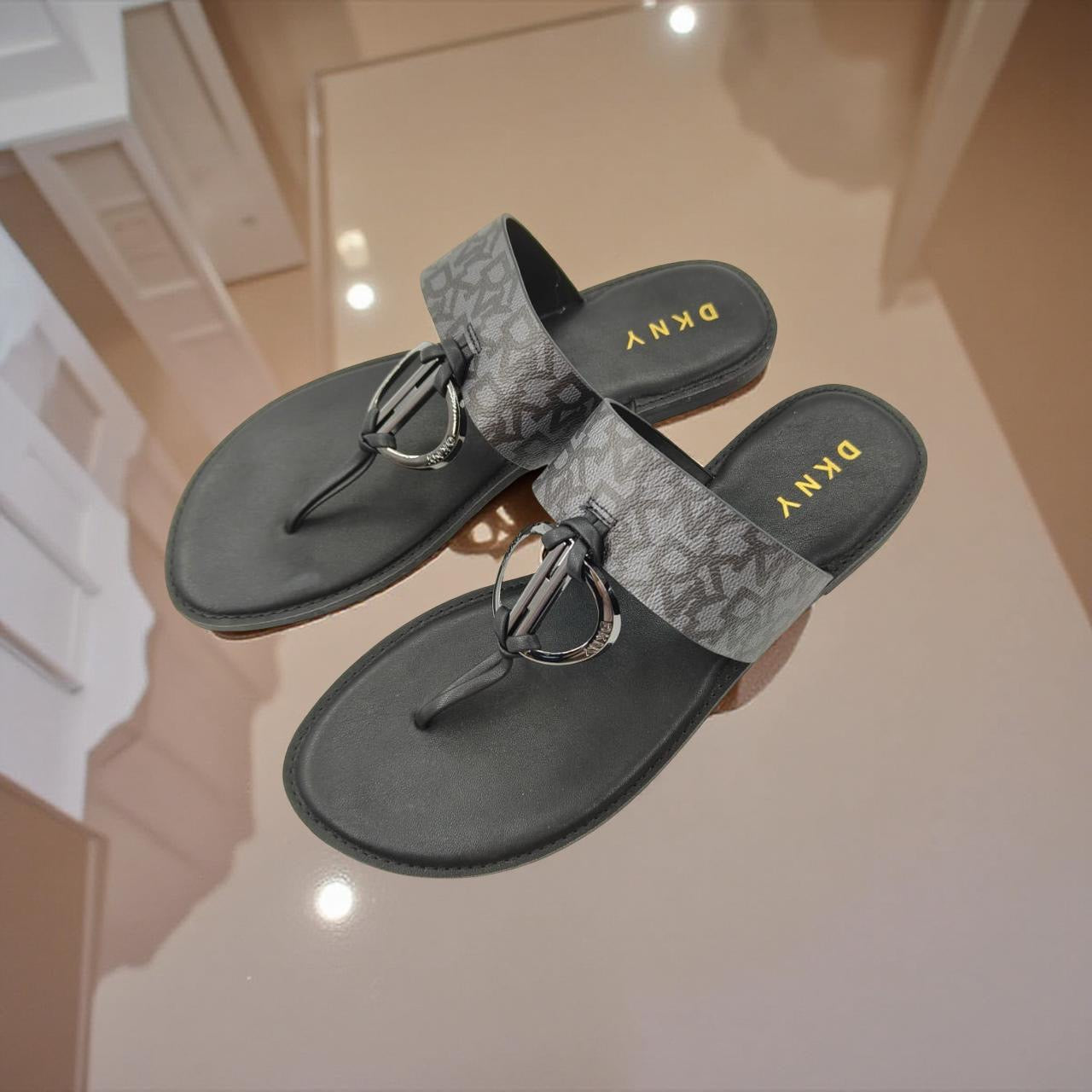 Dkny T-strap Monogram Leather Slippers In Black