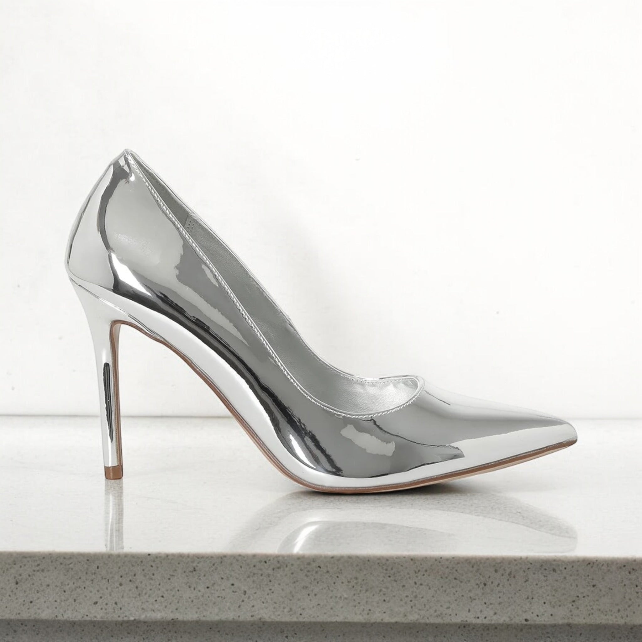 NINE WEST METALLIC POINTED TOE PUMP IN SILVER