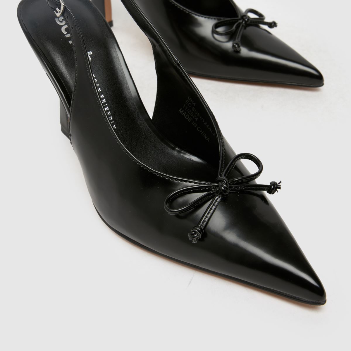 Schuh Bow Detail Patent Leather Pointed Toe Pump in Black